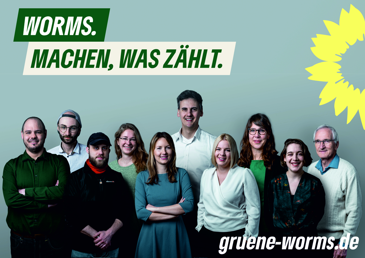 Gruppenbild der Kandidierenden mit dem Slogan: Worms. Machen, was zählt. Logo Sonnenblume rechts